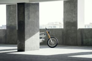 Electric bike behind cement building