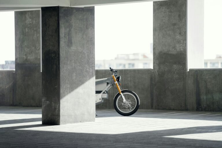 Electric bike behind cement building