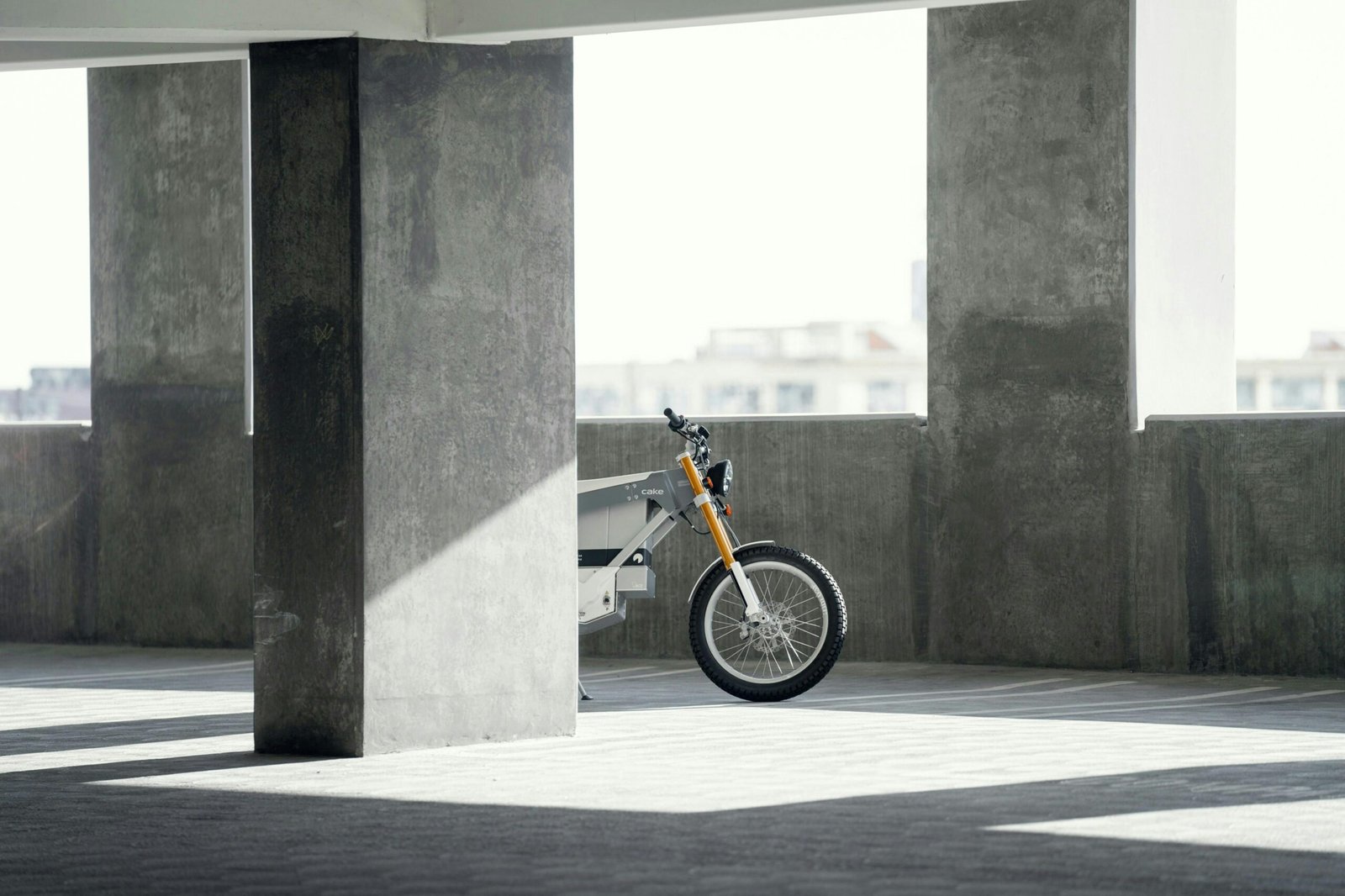 Electric bike behind cement building